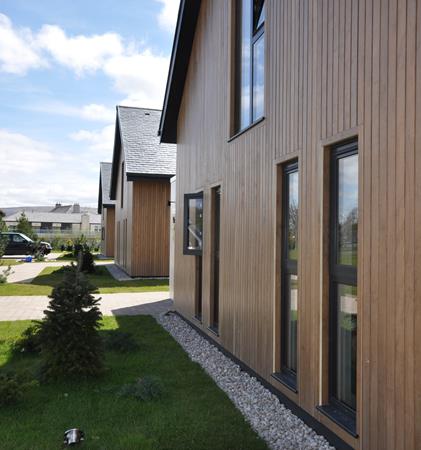 Photograph of the timber cladding on one of the lodges at Lochside.