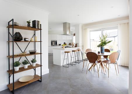 A photograph showing the open plan kitchen dining area inside one of the house types at The Botanics development in Kilmaurs.