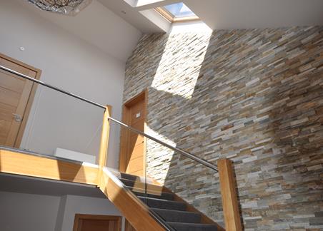 Photograph of an interior staircase and landing area in one of the Lochside lodges.
