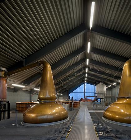 Photograph showing the impressive copper stills inside Lagg Distillery.